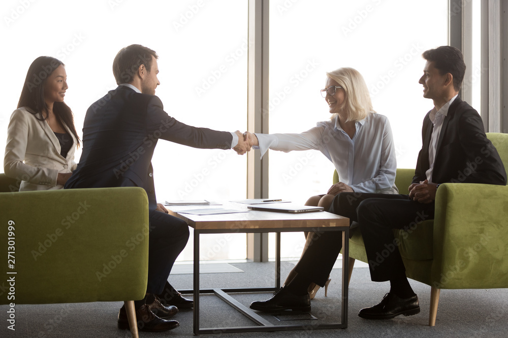 Sticker Diverse business partners handshake at casual meeting