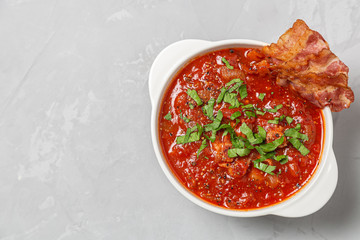 Tomato soup with bacon. The view from the top. Copy-space.