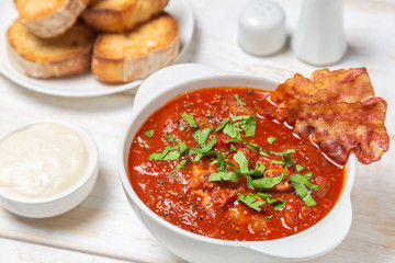 Tomato soup with bacon. European cuisine.