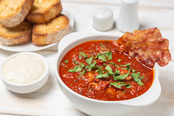 Tomato soup with bacon. European cuisine.