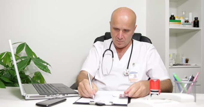 Doctor Jon in Hospital cabinet Write a Medical Prescription and Sign Documents