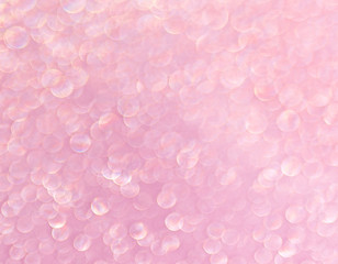Pink background of shining drops of water