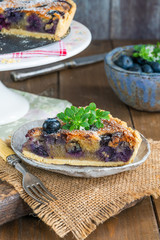 Blueberry and almond tart dusted with icing sugar