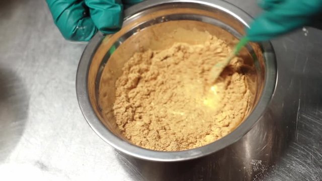 Production of shampoo. Stirring the mixture of an ochre powder and a chemical liquid