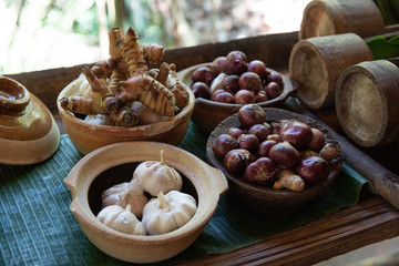 Garlic,okra or lady finger in bamboo bowl with natural background.