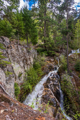 Majestic waterfall in Vancouver, Canada. View with mountain background.