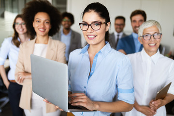 Portrait of business team posing in office