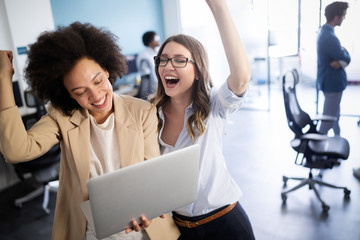 Group of successful business people at work in office