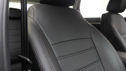 Black leather seat covers in the car. beautiful leather car interior design. stylish leather seats...