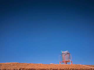 Obraz premium Environmental issues highlighting water supply with image of Water Tank On Roof In Sun