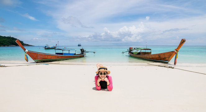 Women lie on the beach and the sea have a holiday summer relaxing and travel bright sky koh lipe thailand