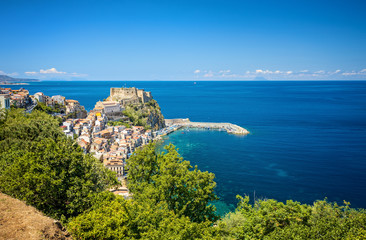 Panorama with beautiful beaches and old castle of medieval town of Scilla in Calabria, Italy. Italian summer travel holiday - obrazy, fototapety, plakaty