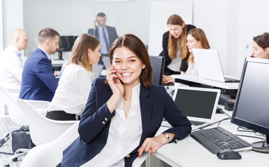 businesswoman having phone call conversation at workplace