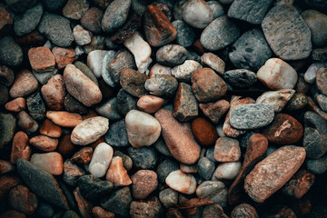 Closeup shot of ornamental gravel that has mixed colors, sizes and shapes – Hard and rough construction material used in decorations