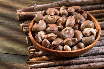 Anacardium occidentale - Organic cashew nuts. Wood background