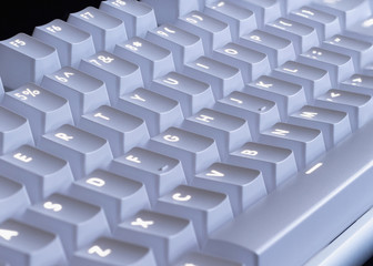 white LED glowing mechanical keyboard - close up