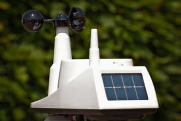 A device that measures speed, force and direction of the wind. White anemometer with solar panels...