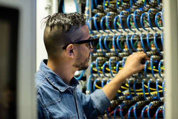 Mainframe engineer analyzing system of database storage