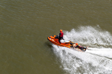 Life and coast guards get training and cruising on their jet-skie scooter on the calm North-Sea water