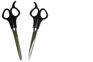 Black professional scissors for cutting regular and thinning. Isolated objects on white background. The working tools of a hairdresser.