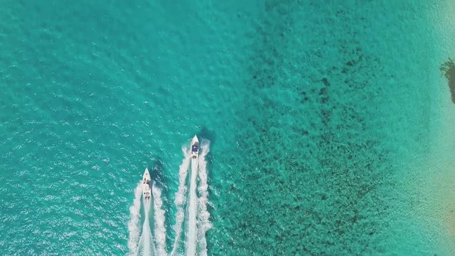 drone bird view of 2 boats in the bahamas. summer vaction