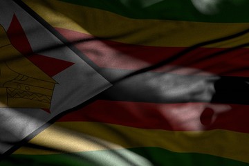 wonderful image of dark Zimbabwe flag with folds lay in shadows with light spots on it - any feast flag 3d illustration..