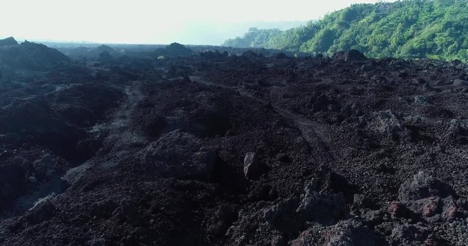 Aerial shot black solidified volcanic lava 4K