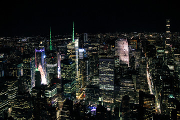 aerial night panorama of new york manhattan with glowing times square - top view