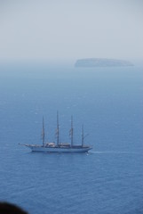 Ship sailing off the coast of Santorini Island
