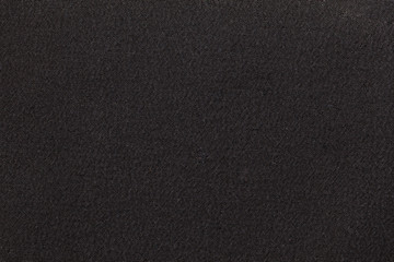 Dark gray fabric background texture. Detail of textile material close-up