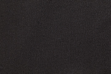 Dark gray fabric background texture. Detail of textile material close-up