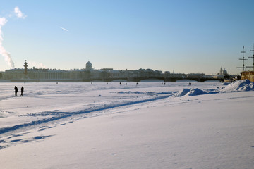 View of the frozen Neva river and historic city center of Saint-Petersburg, Russia. Color winter photo.