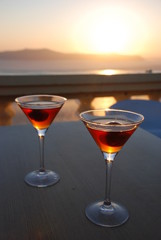 Two glasses of vinsanto wine on the Santorini sunset.