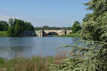 Fototapeta na wymiar Vanburgh Bridge and the lake - Blenheim Palace, Woodstock, Oxfordshire, England, UK
