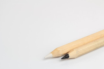 Obraz premium White and black pencils on white background
