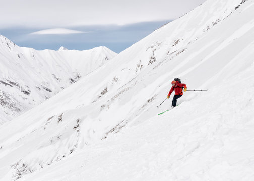 Georgia, Caucasus, Gudauri, man on a ski tour riding downhill