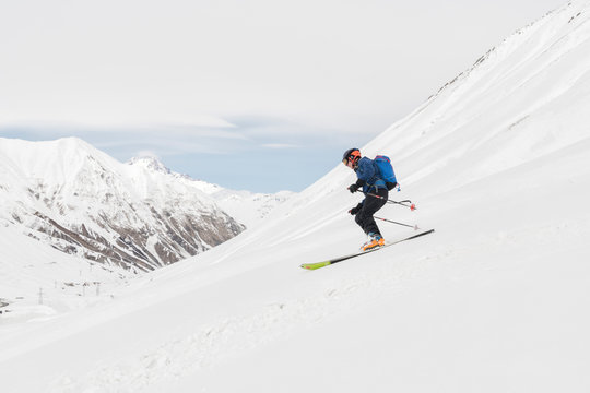 Georgia, Caucasus, Gudauri, man on a ski tour riding downhill