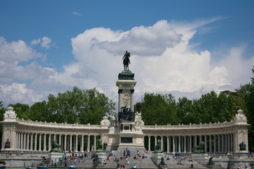 Crowd in front of monument overlooking the lake at Parque del Buen Retiro, Madrid