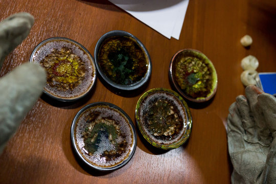 meeting potters. training courses for novice ceramists. reportage. many ceramic examples of clay saucer with melted colored glass. firing at 1200 degrees Celsius.