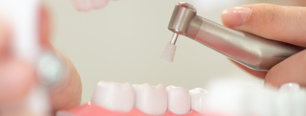 a reception in the dentist's office, cleaning the enamel of teeth