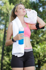 attractive sportive woman taking a break from her training