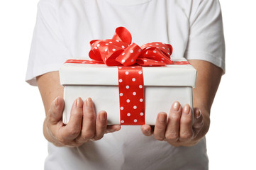 Cropped shot of woman holding gift box isolated