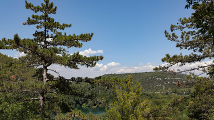 View from tree trail in the National Park of Croatia onto the lake in the mountains