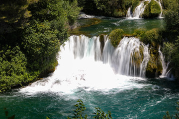 Close view to the waterfall in the mountain lake in the national park of Croatia