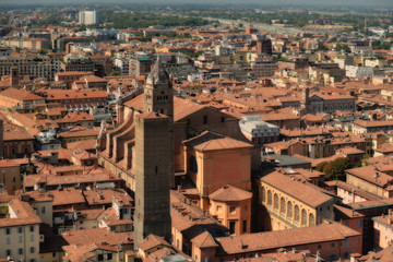 Fototapeta premium Aerial panoramic cityscape of Bologna, Italy, above rooftops of typical houses, ancient buildings and medieval towers