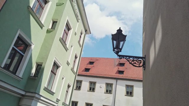Vintage lantern on a house wall in the historic part of Regensburg, Germany