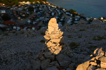 Small pile of stones in the mountains during the sunset