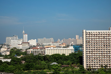 Elevated view cityscape of modern architecture buildings over blue clear sky in downtown Pattaya, Thailand
