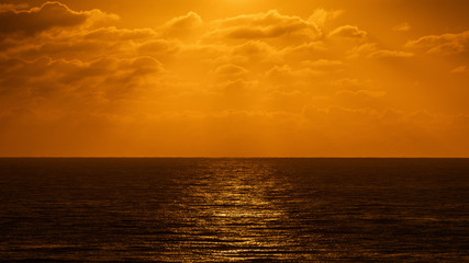 Beatiful sunset above the mediterranean sea. Sunrise with red and orange skies and the sun shining over the ocean