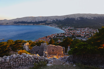 Fototapeta na wymiar Summer city on a bay shore in the Adriatic sea, Croatia. View from the hill